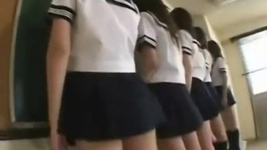 Japanese schoolgirls are being naughty with each other, while they are kissing each other's hairy lover