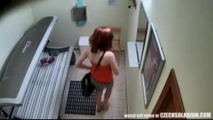 Red haired woman is playing with her perfectly shaved pussy and enjoying every second of it