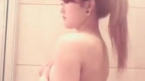 Bad girl is having sex and experiencing her own orgasm with a glass dildo in some bathroom