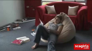Blonde chick in red shoes with high heels is fucking her horny boyfriend, on the sofa