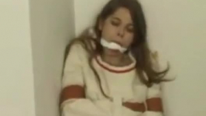 Gagged brunette is being tortured by a nasty, older guy who likes to watch her with pleasure.