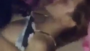 Dirty girls having a lesbian threesome with some strap ons at another party